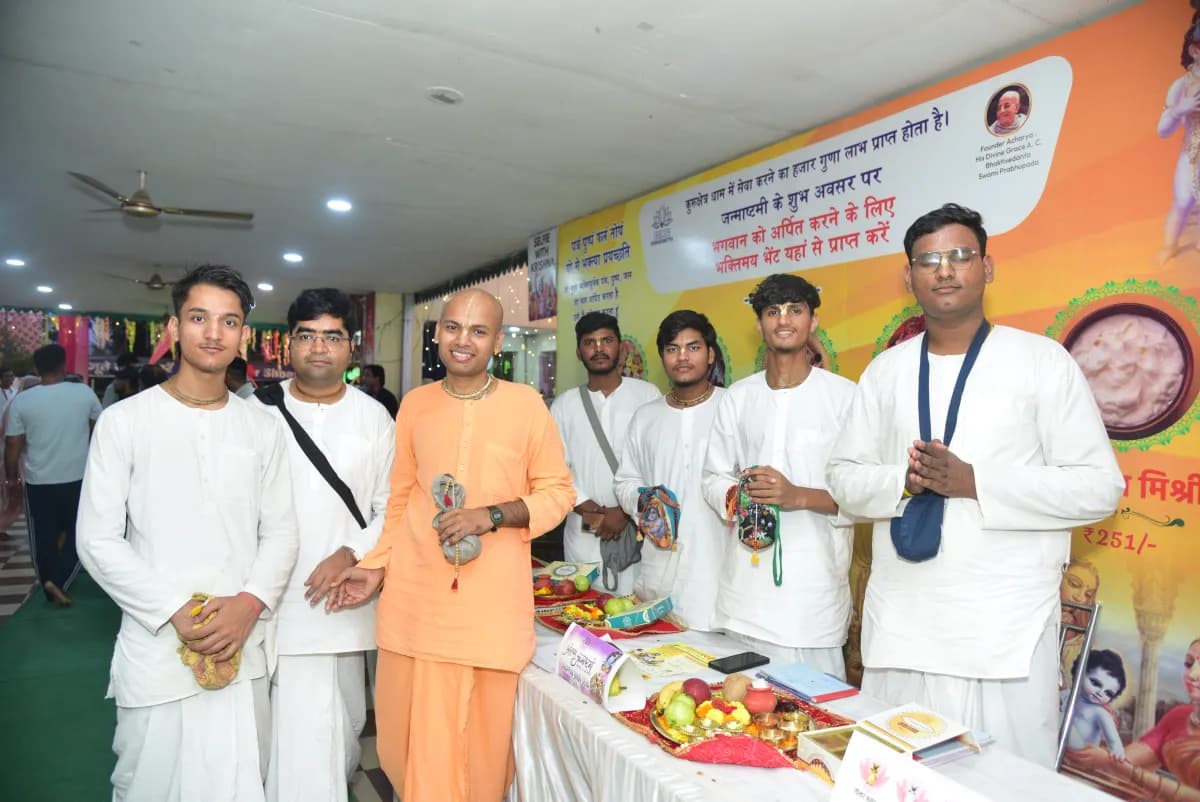 A sadhu with devotees at the temple