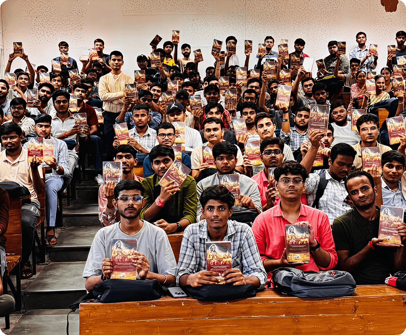 Students of the Online Bhagavad Gita Course holding their copies of the Bhagavad Gita