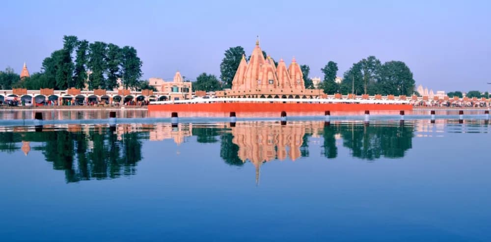 A temple reflected in the still waters of a sacred lake at Kurukshetra