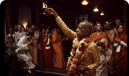 Priest offering a lamp to the Lord during Raj Bhoga Arati
