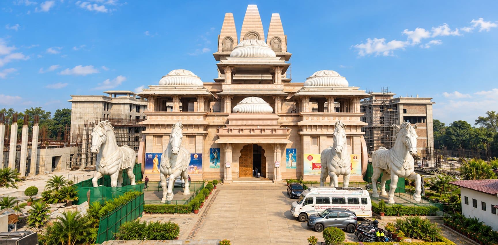 The rising ISKCON Kurukshetra temple with its chariot horses at the main entrance