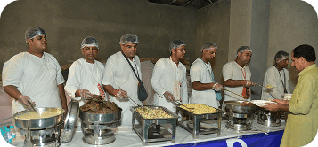 Volunteers serving prasadam to the community
