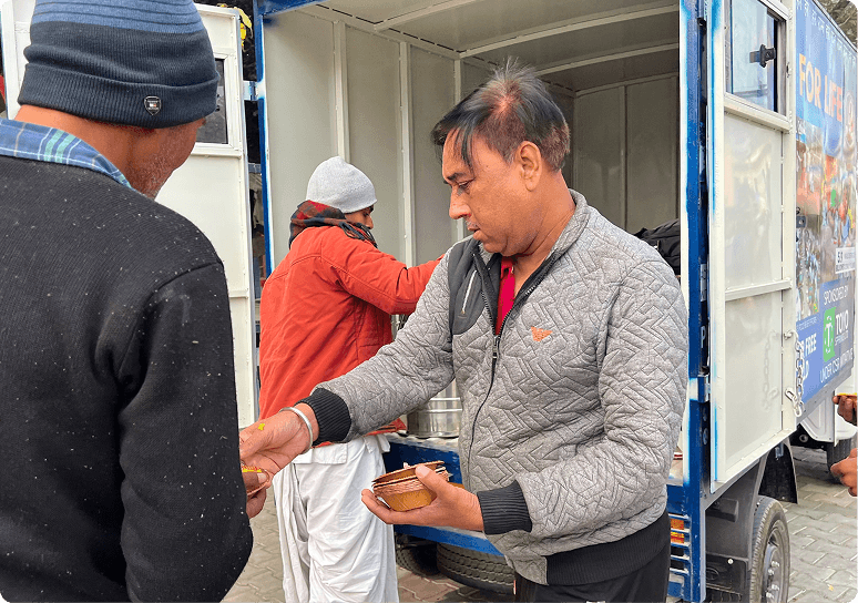 Prasadam being handed out from the ISKCON Food for Life van