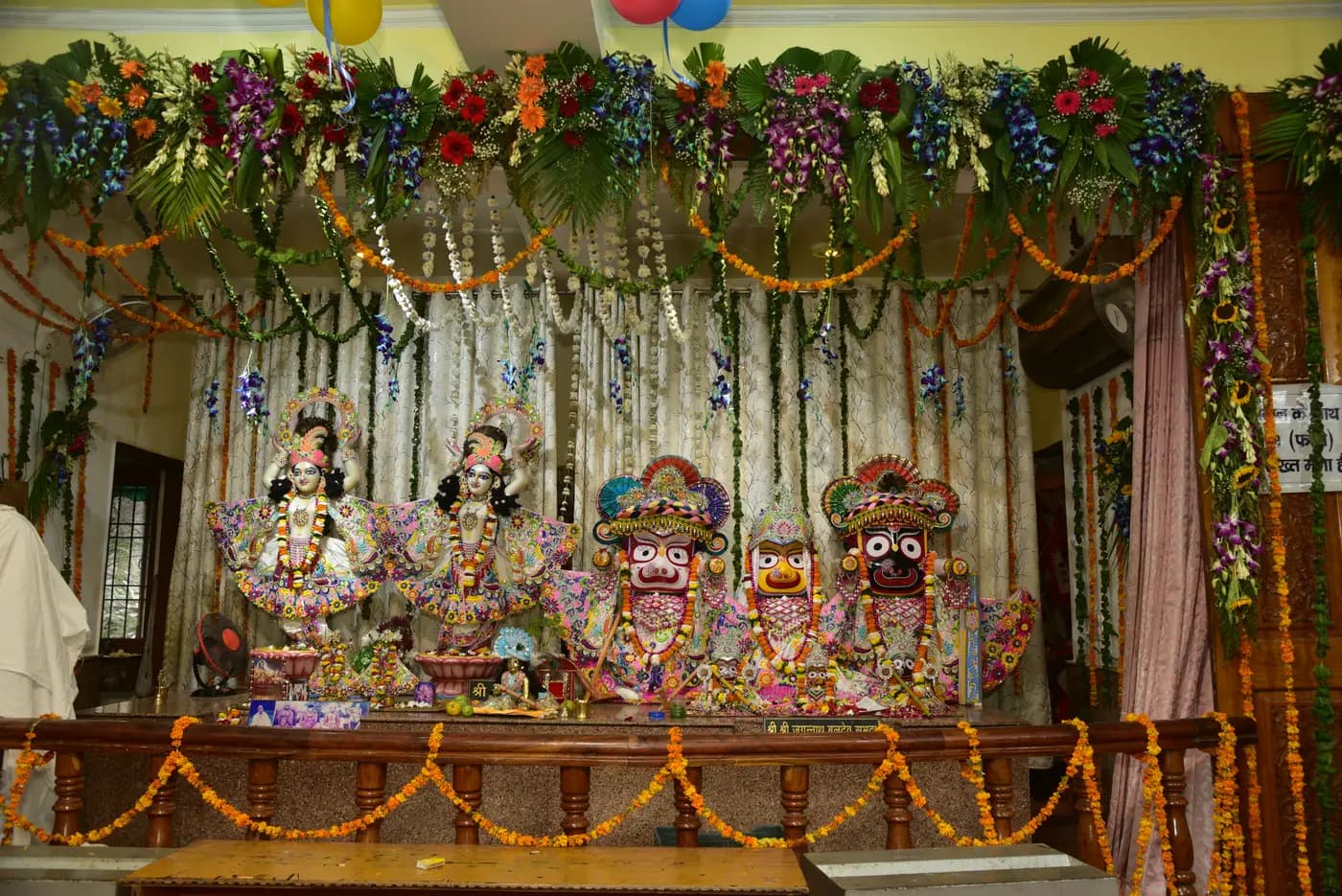 The temple altar dressed in flower garlands for Janmashtami