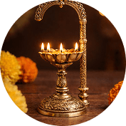Tiered aarti lamp aglow during the evening ceremony