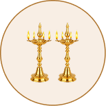 A pair of tiered brass aarti lamps