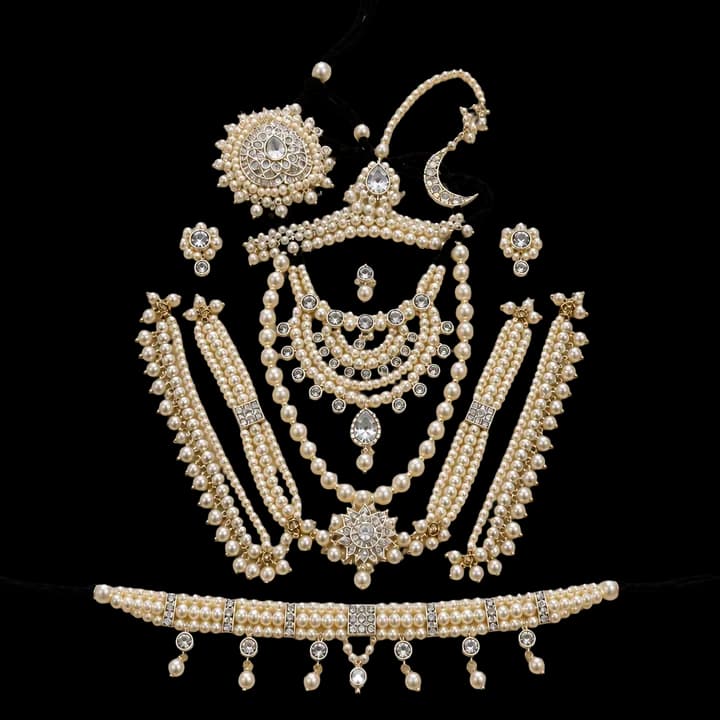 A set of pearl and gold ornaments for the Deities